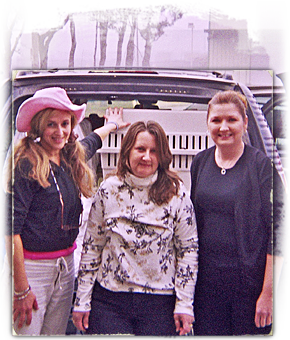 Brenda Shoss, Kathy Sweeney and Ramona Billot load animals for Kinship Circle to transport for outstate adoption 290x240