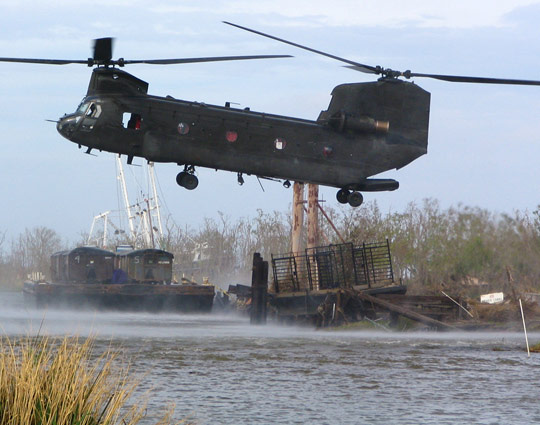 New Mexico National Guard rescuers needed to bring a barge to where cows where in Port Sulphur, otherwise the cows would not make it 540x425