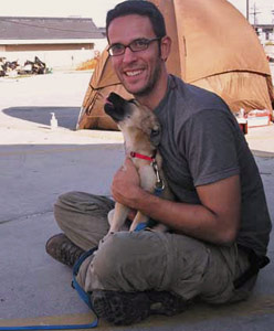 My rescue partner has a cuddly moment with one of the saved pups at Camp Winn Dixie 248x300